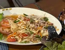A plate of spicy Green Papaya Salad (Som Tum)
