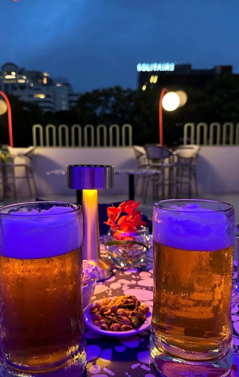 Having beer at a rooftop bar in Bangkok