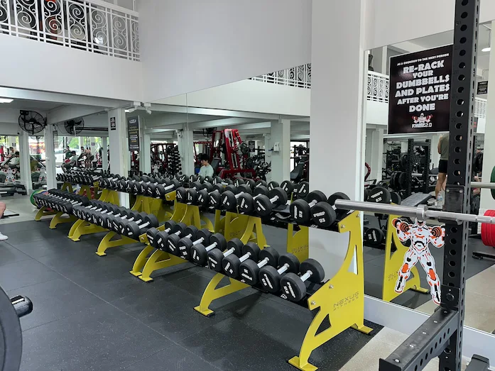 Picture taken inside the ground floor of Pump Fitness 2.0 in Chiang Mai, Thailand. The picture shows the dumbbell area of the gym.
