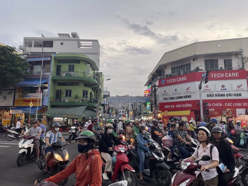 intense Saigon traffic, locals on their motorbikes driving all over
