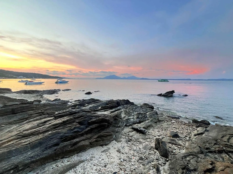 A beautiful sunset with orange and purple clouds over Luk Yon Bay, Koh Samet.