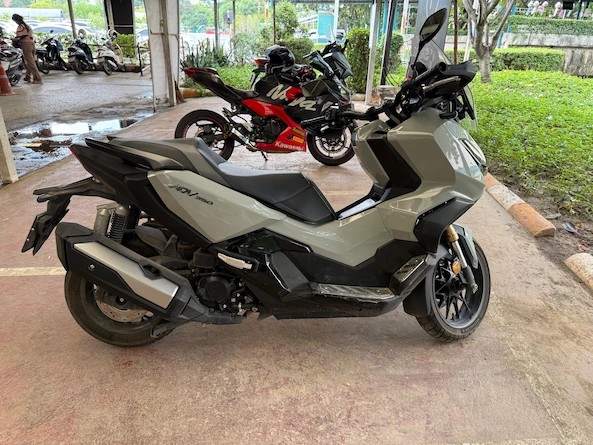 Picture of a grey ADV 350 in a parking lot in Thailand.