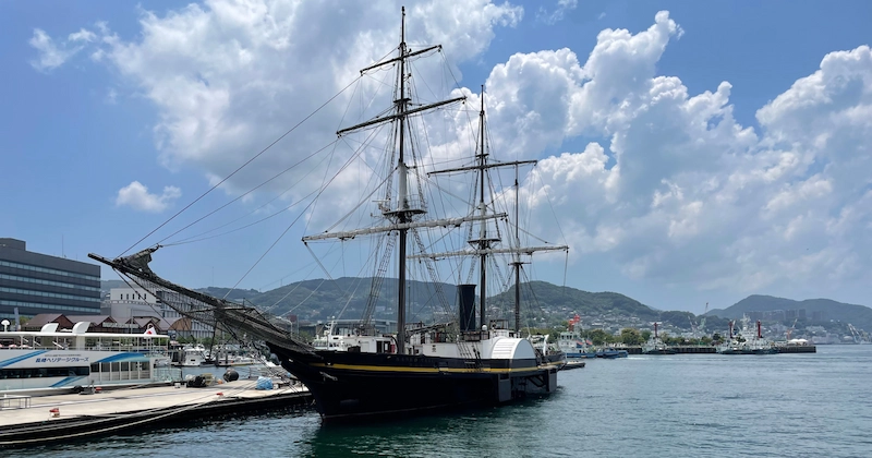 Photo of a beautiful, sailing ship by the harbour of Nagasaki
