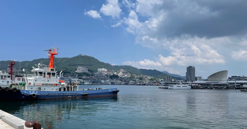 Photo of the Nagasaki Harbour and a ship of the coastguard in front