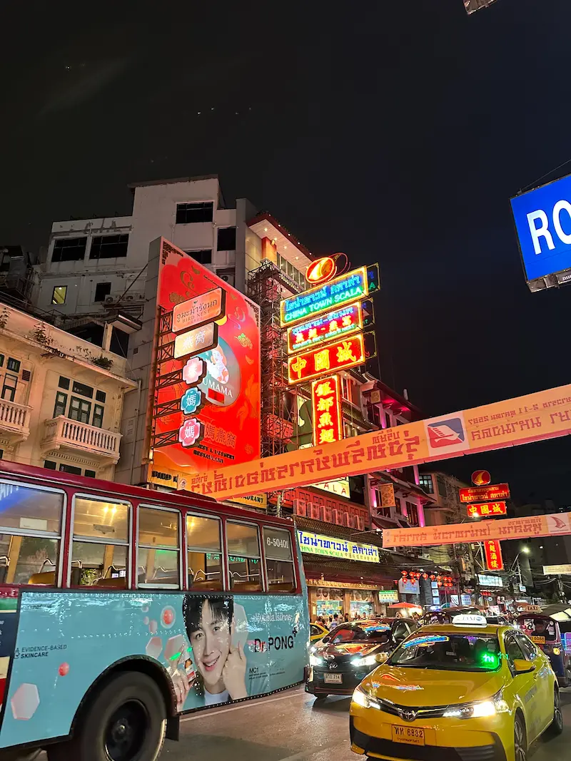 Neon lights and street traffic at Yaowarat Road Chinatown in Bangkok at night