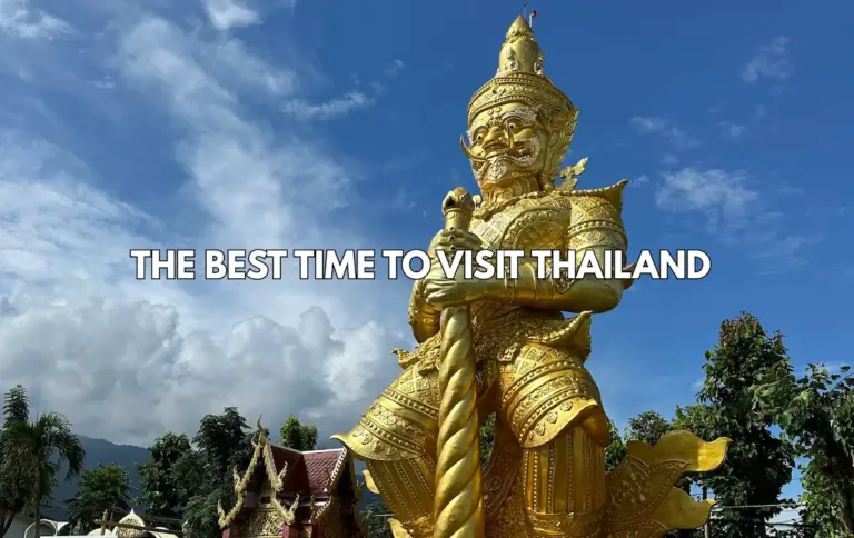 Giant golden Wat Dhammakaya statue in Thailand under blue skies with text overlay The Best Time to Visit Thailand