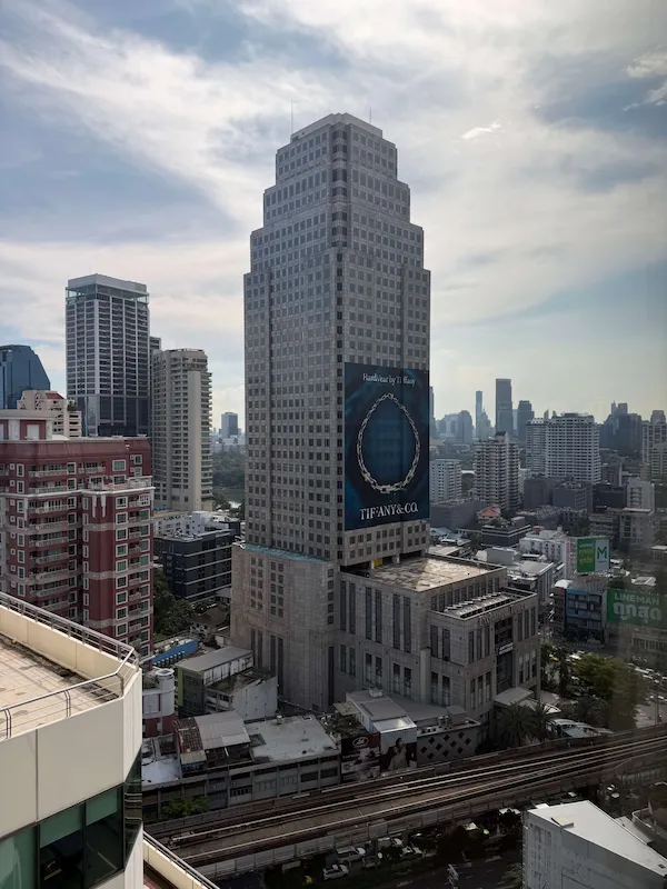 View over the BTS Skytrain line and high-rise towers near Asok from a high floor of Jasmine City Hotel